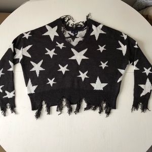 Gray sweater with white stars.